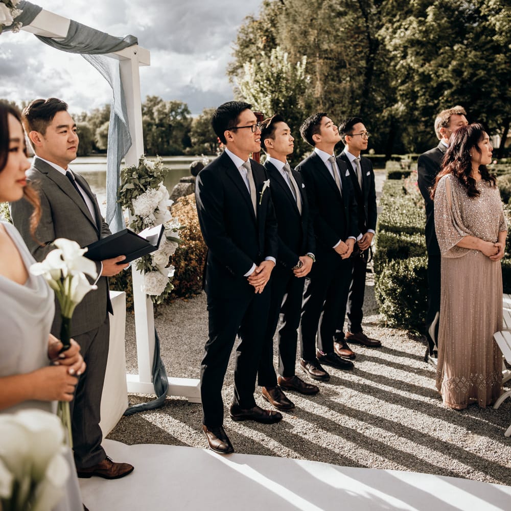 Groom and groomsmen standing at the altar waiting for the bride to arrive 