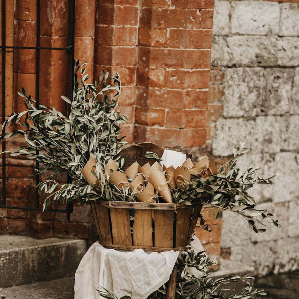 A basket of olive bouquet wedding favours