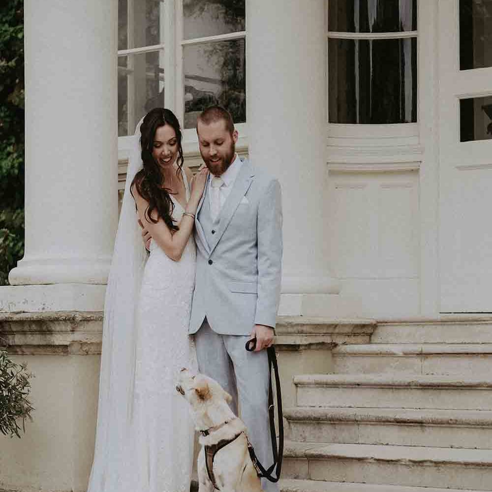 Bride and groom with pet dog at Pylewell Park wedding