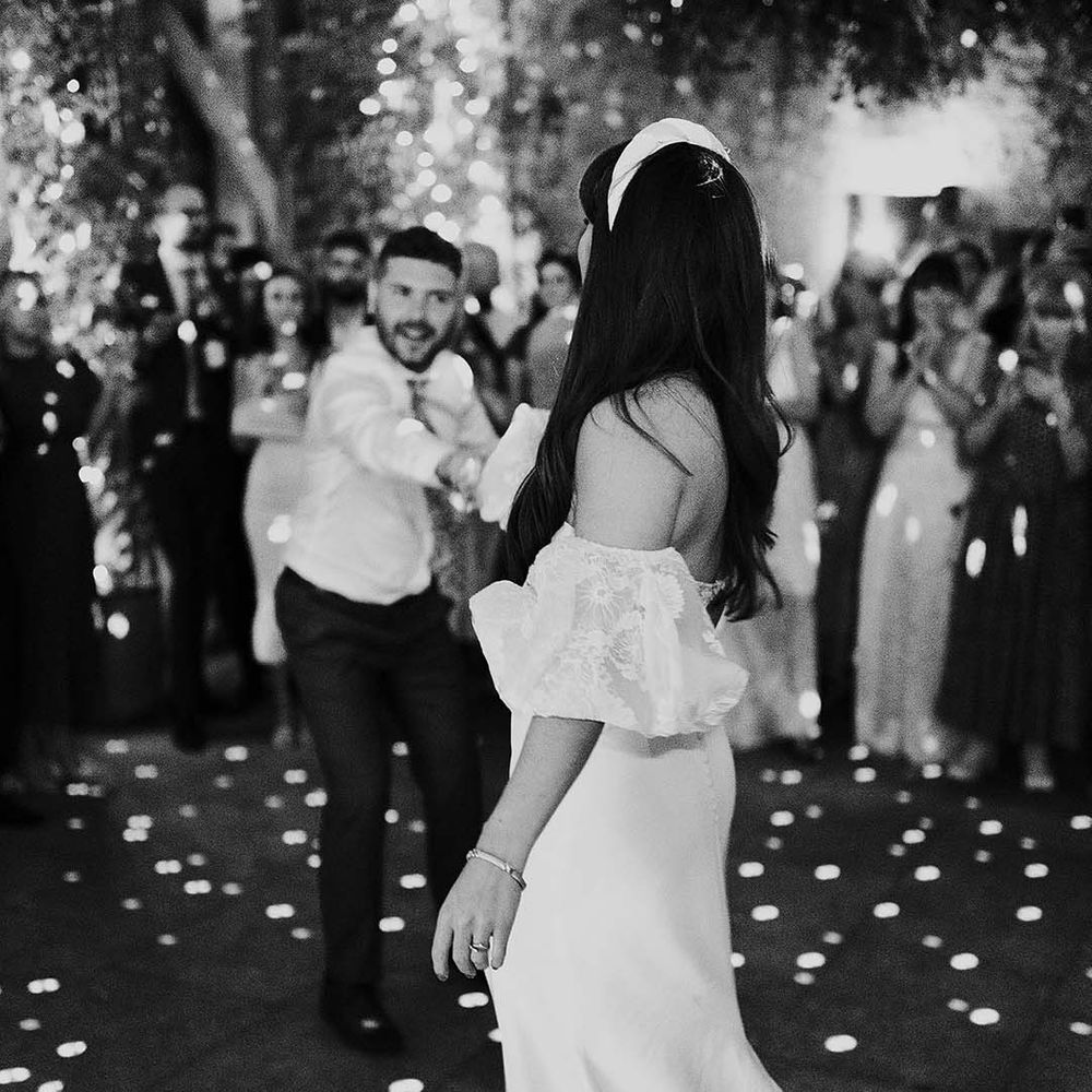 Bride & groom dance on their wedding day during reception party
