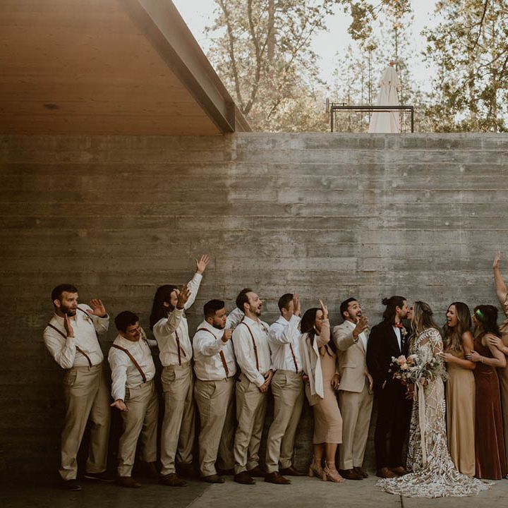 Bride & groom stand with their wedding party