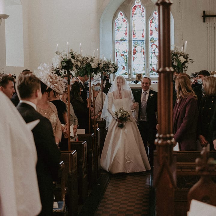 Bride in long white wedding dress with square neck and long veil and groom at Hedsor House wedding