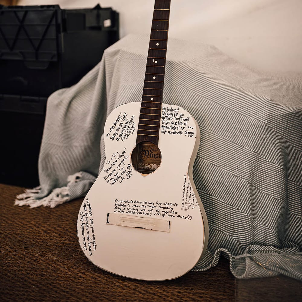 White painted guitar alternate guestbook idea for marquee wedding 