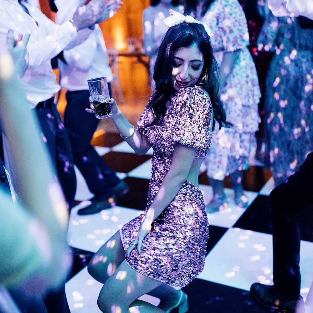 Bride in a pink sparkly evening reception dress at Elmore Court multicultural wedding