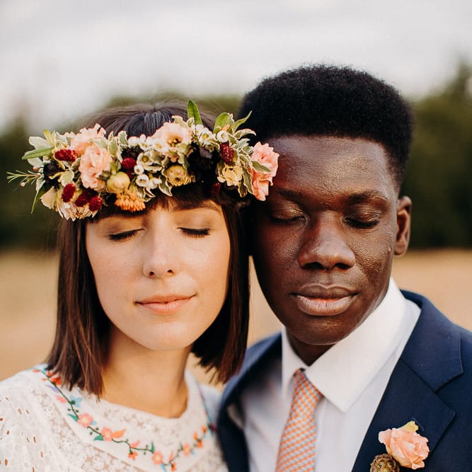 Intimate portrait of a Black British groom and White British bride 