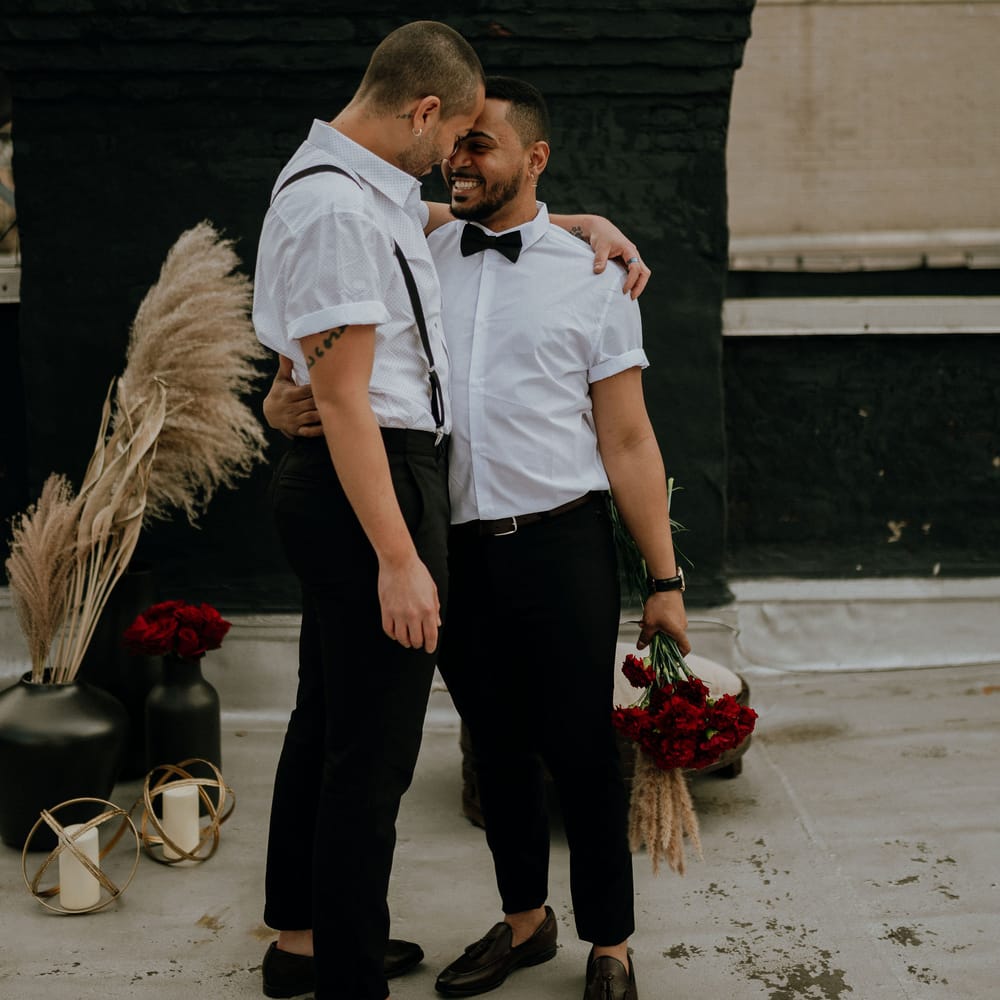 Red flowers for intimate gay elopement in New York
