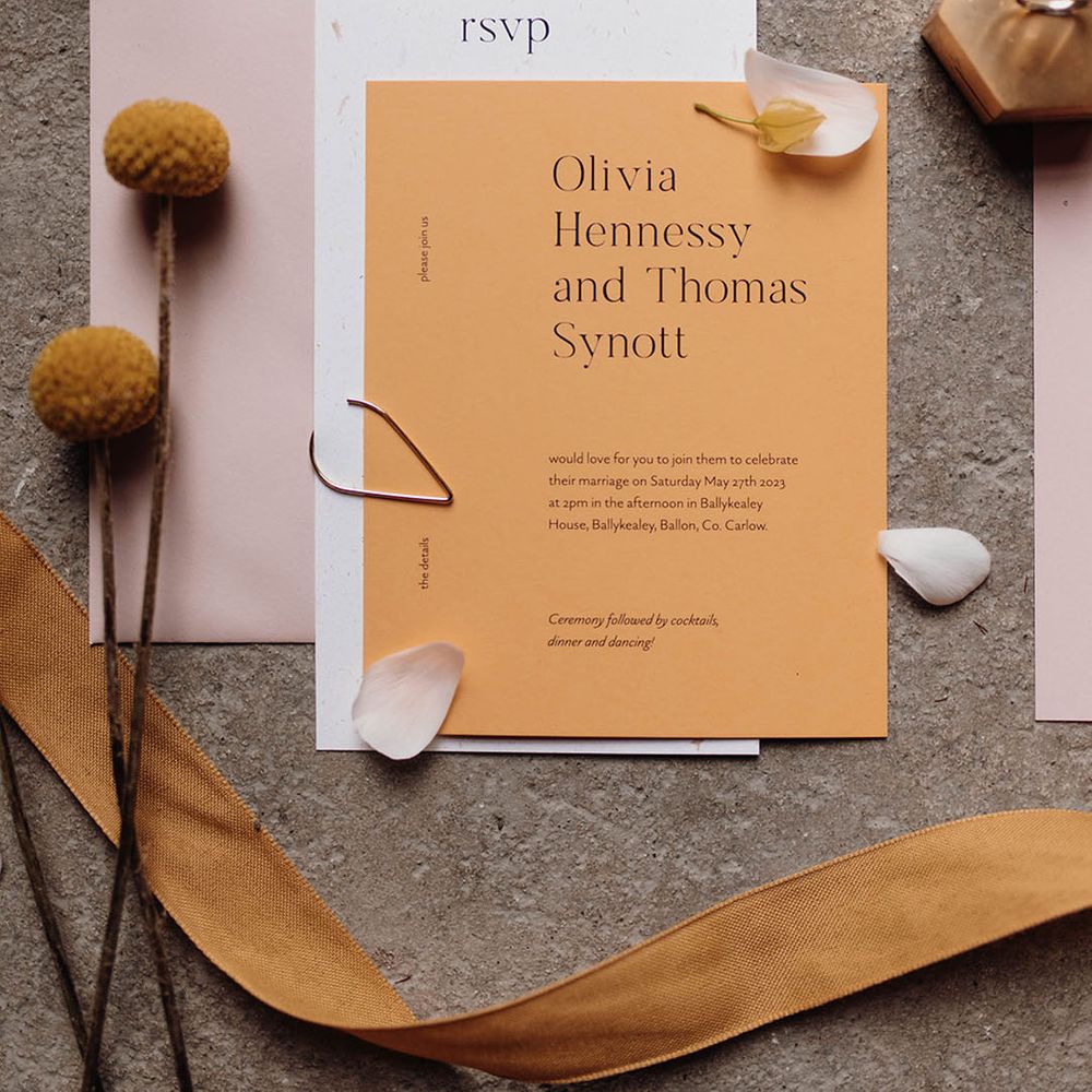 Contemporary pastel pink, white and yellow stationery suite designs with black font 