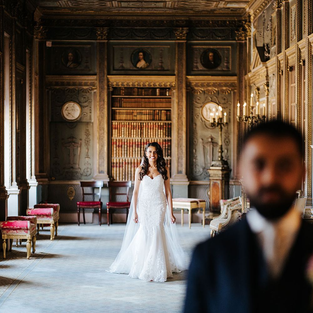 Bride walks down grand room at Syon Park before first look moment with her groom 
