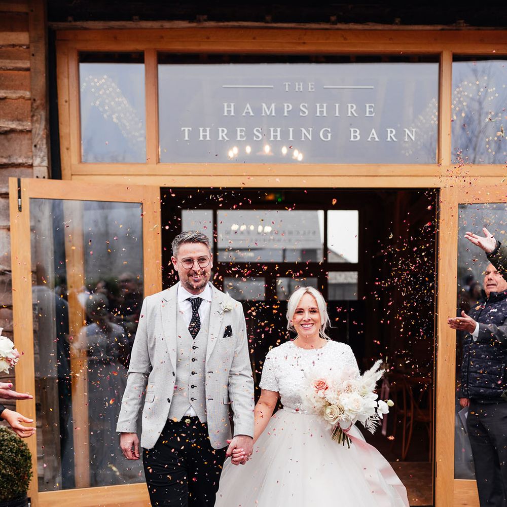 Silchester Farm wedding venue with the bride in bridal separates and the groom in light grey suit for cosy winter wedding 