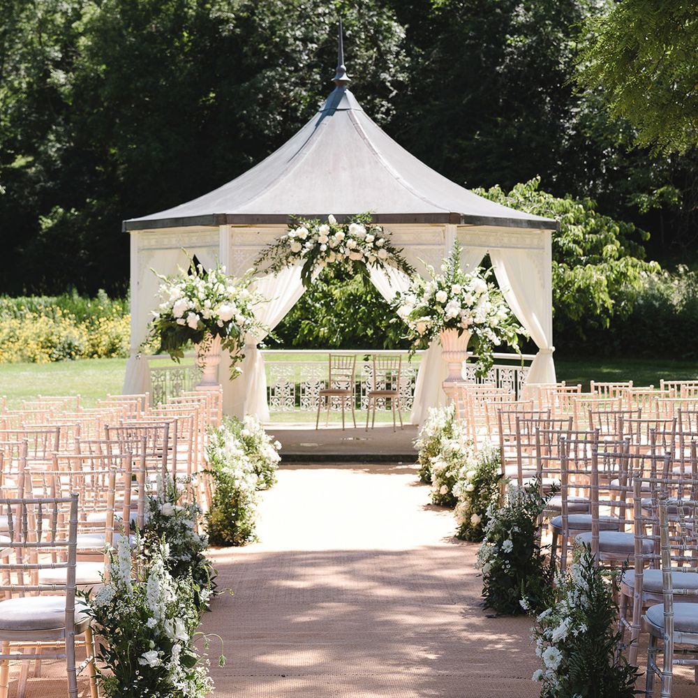 The Manor House, Castle Combe outdoor gazebo wedding ceremony on summer's day 