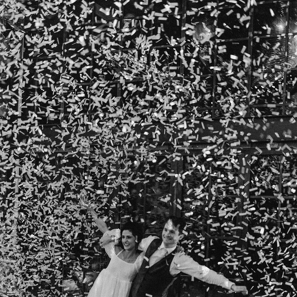 Epic confetti moment for the bride and groom as they have their first dance together 