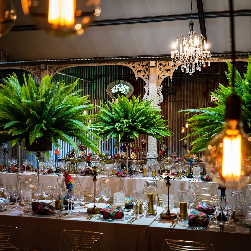 Tropical leaf tall table centrepieces