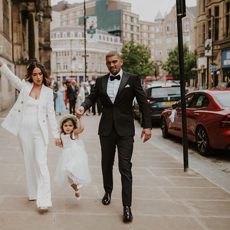 Sheffield registry office wedding with bride in a white suit, groom in a black tuxedo and flower girl with gypsophila flower crown 