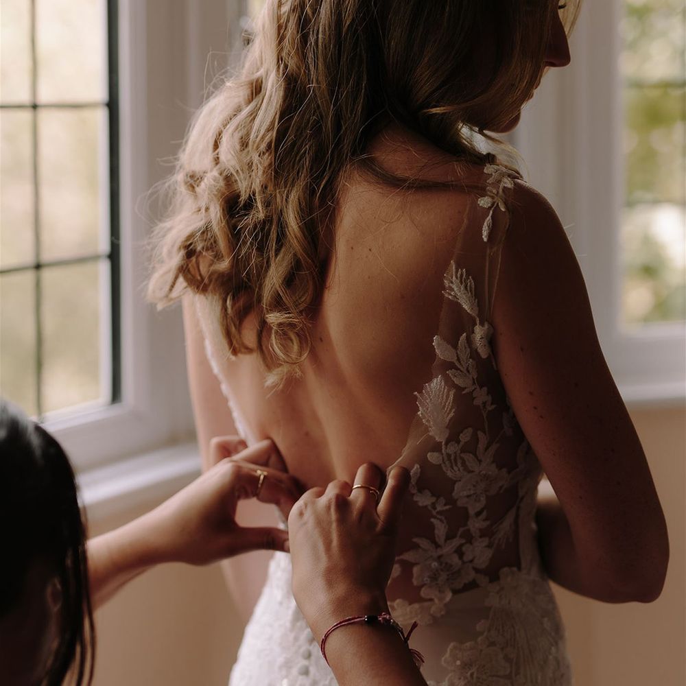 Lace detail low back Pronovias wedding dress