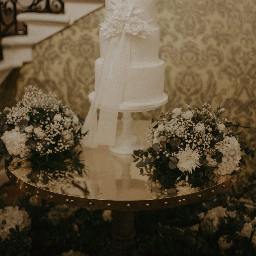 Large white semi naked wedding cake at Hedsor House wedding