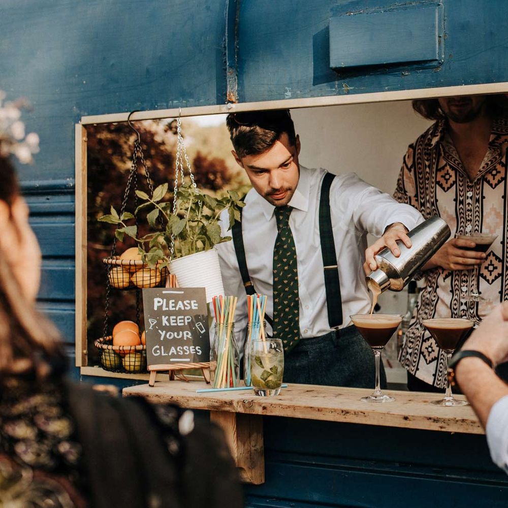 DIY drinks bar in old van at garden wedding reception