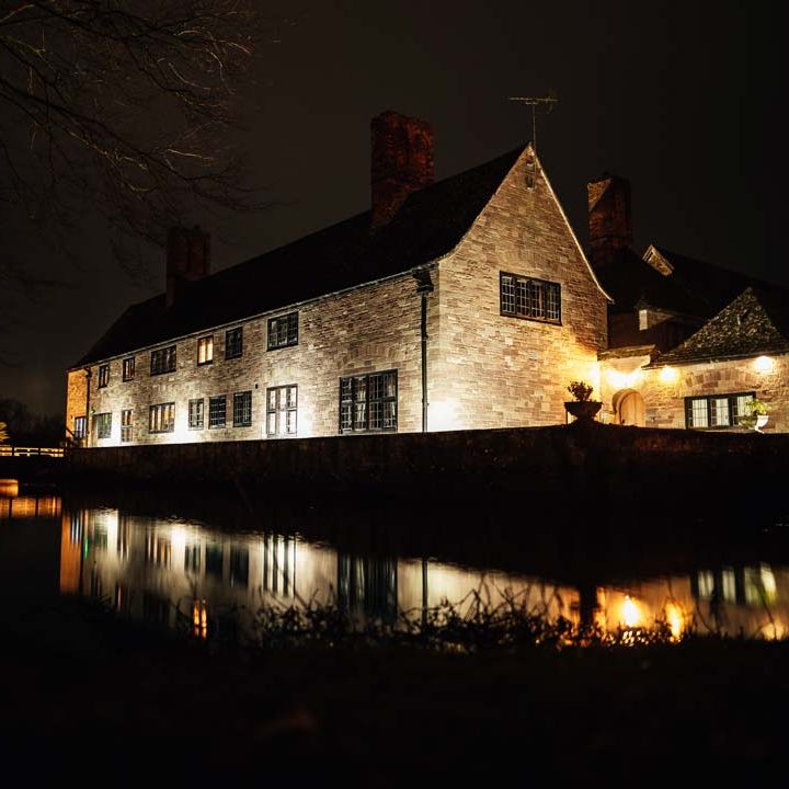Exterior of Brinsop Court wedding venue at night 