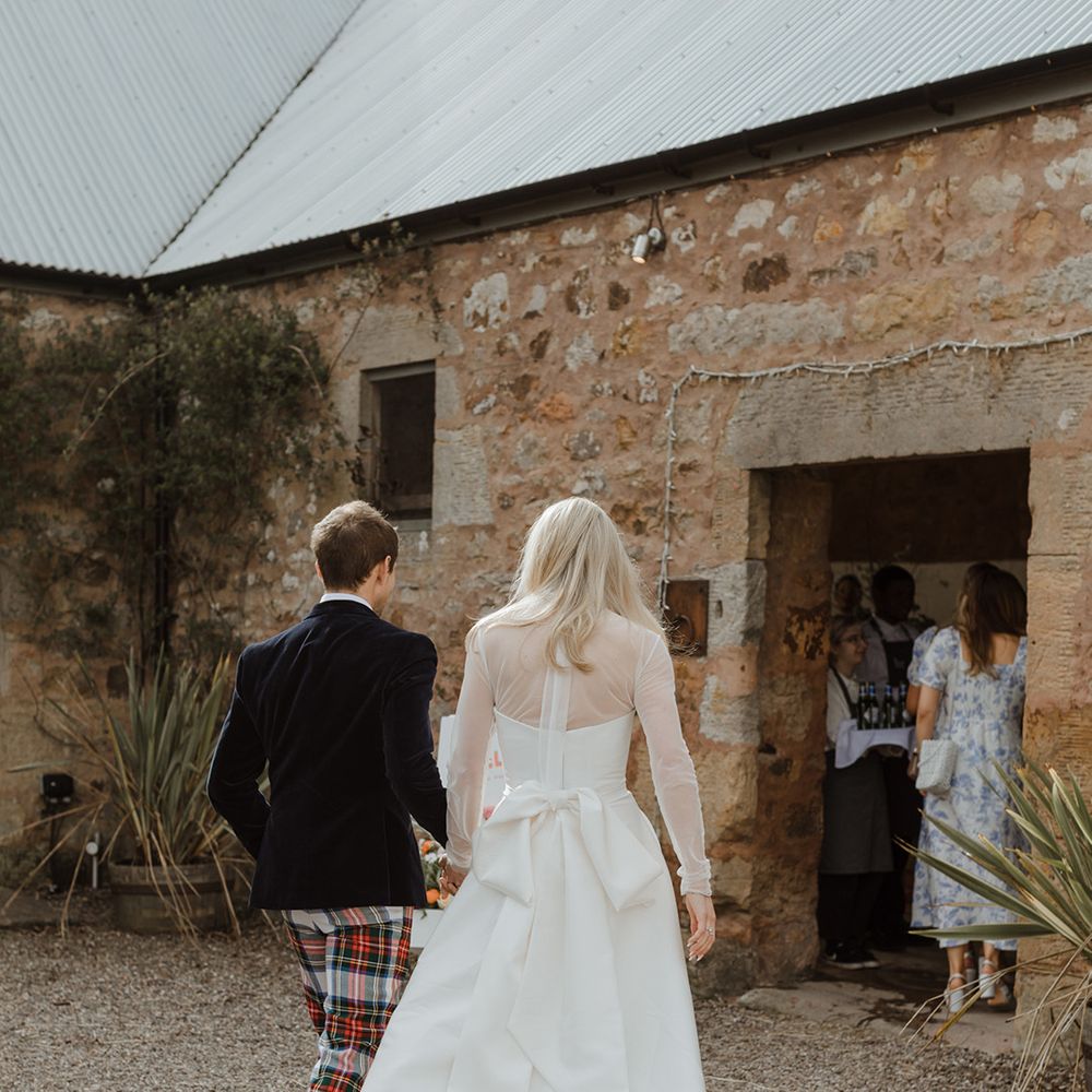 Bride in wedding dress with large bow detail 