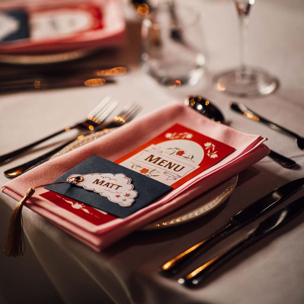 Fairground style place setting for carnival wedding with carousel 