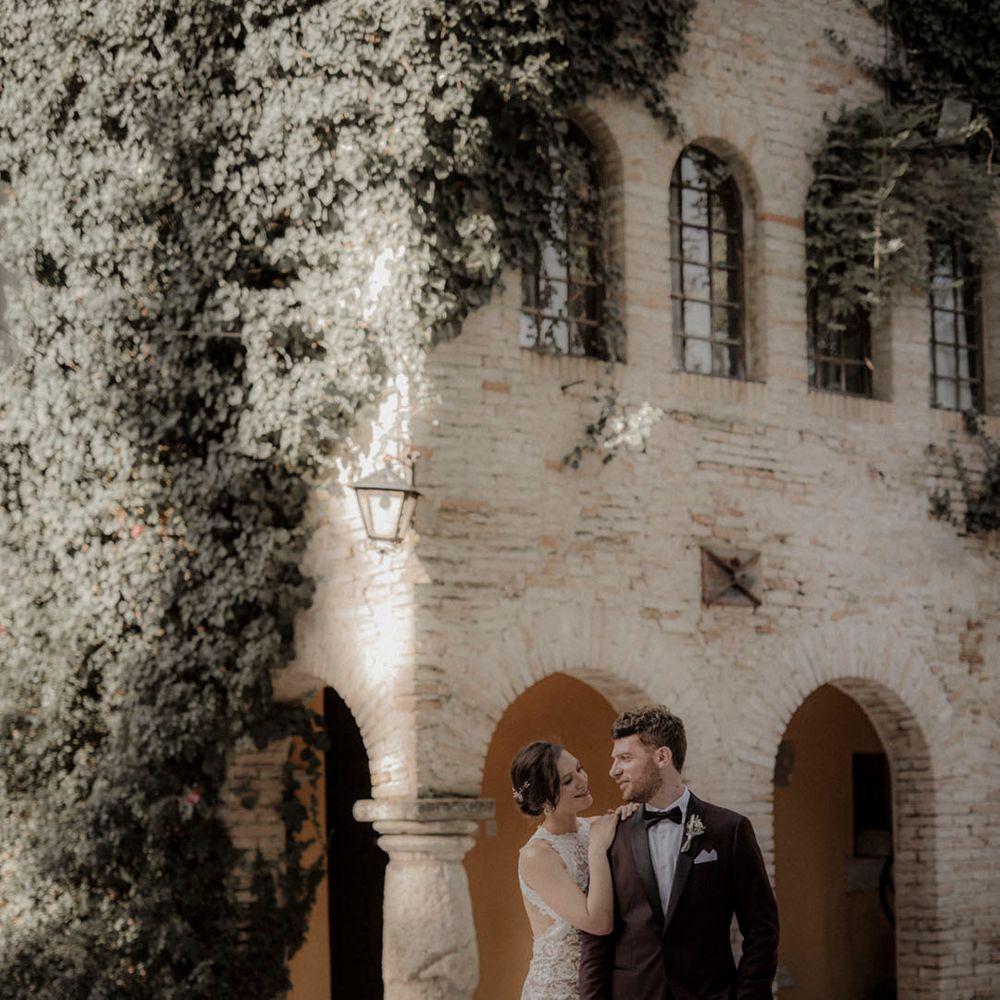 Italian villa destination wedding with bride and groom posing for couple portrait 