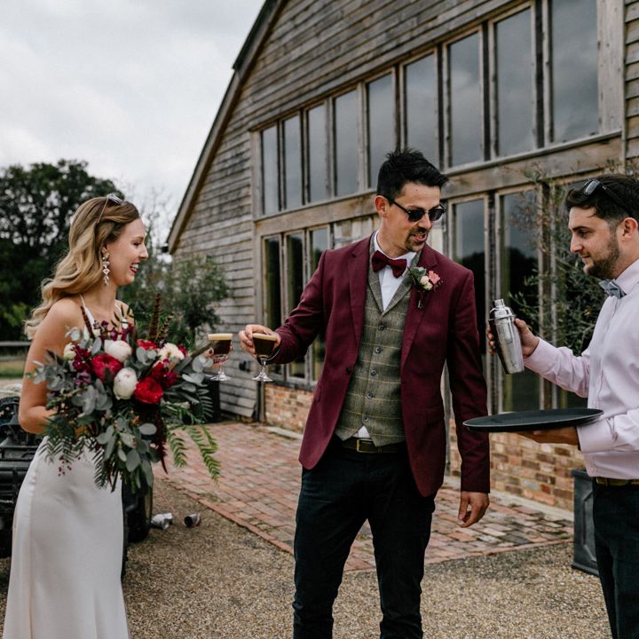 Bride and groom at drinks reception with expresso martini's