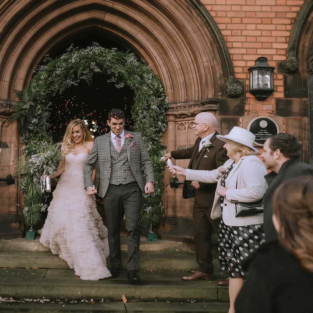 Confetti moment for bride and groom at micro wedding
