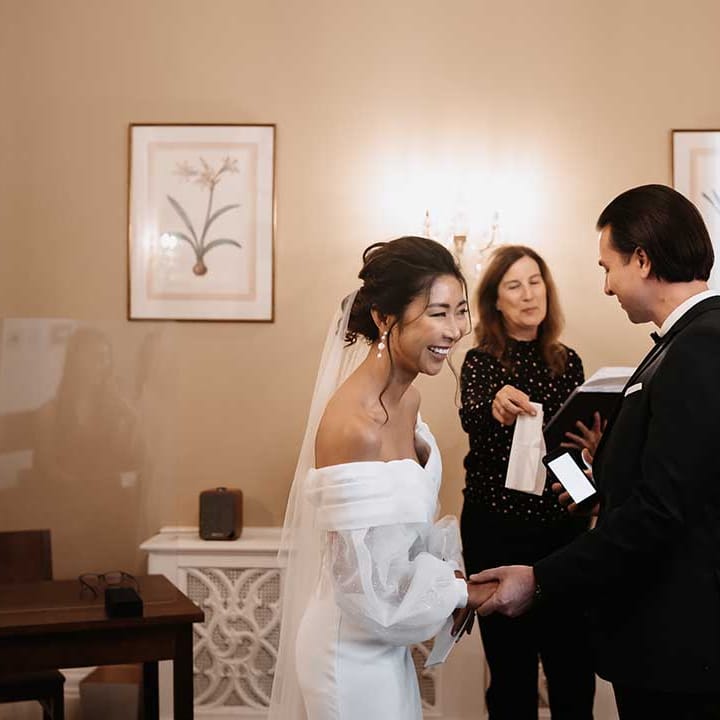 Town Hall Wedding Bride with hair up soft curls and groom 