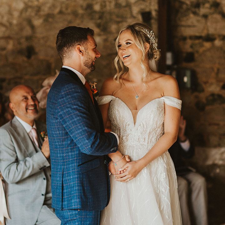 Bride and groom at barn wedding venue