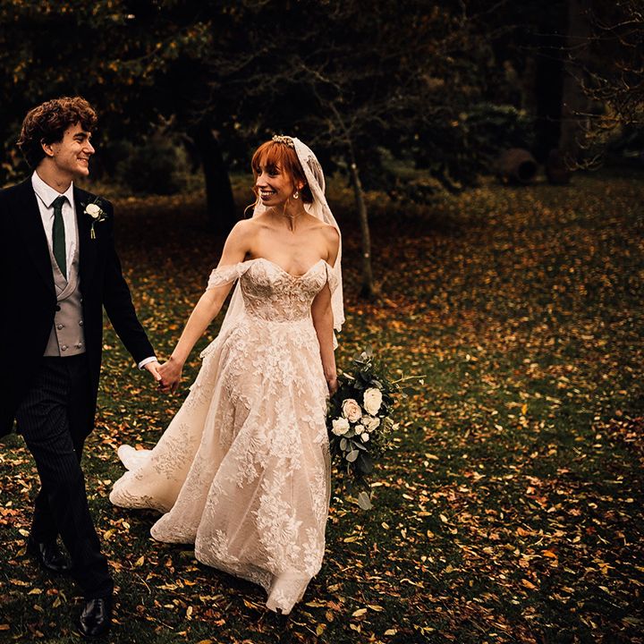 Bride and groom walk hand in hand