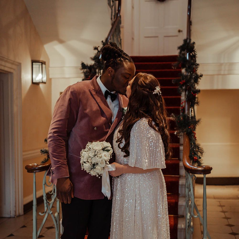 Bride & groom kiss after wedding ceremony