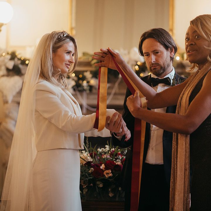 Bride & groom during handfasting ceremony at Gosfield Hall 