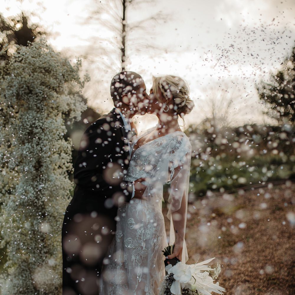 white snow confetti wedding photograph at Hodsock Priory winter wedding