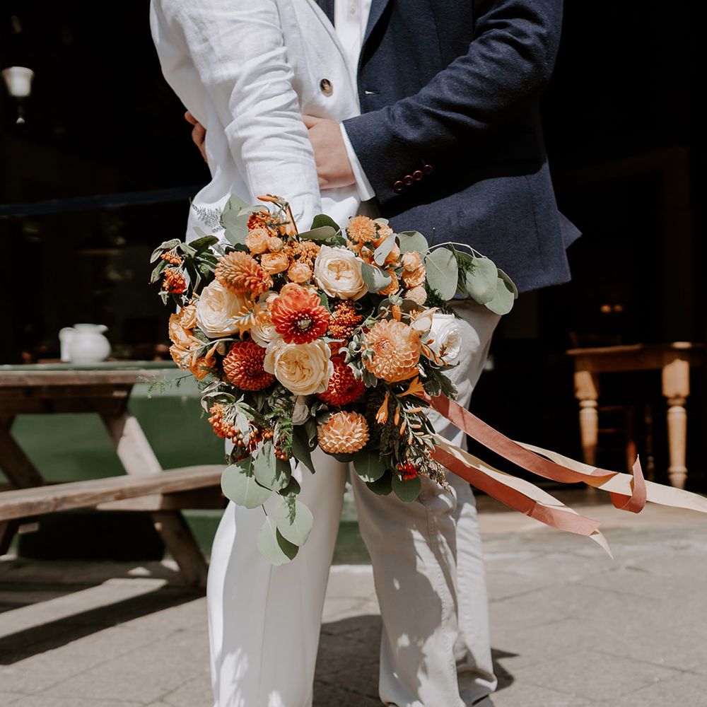 Burnt orange mixed flower bouquet 