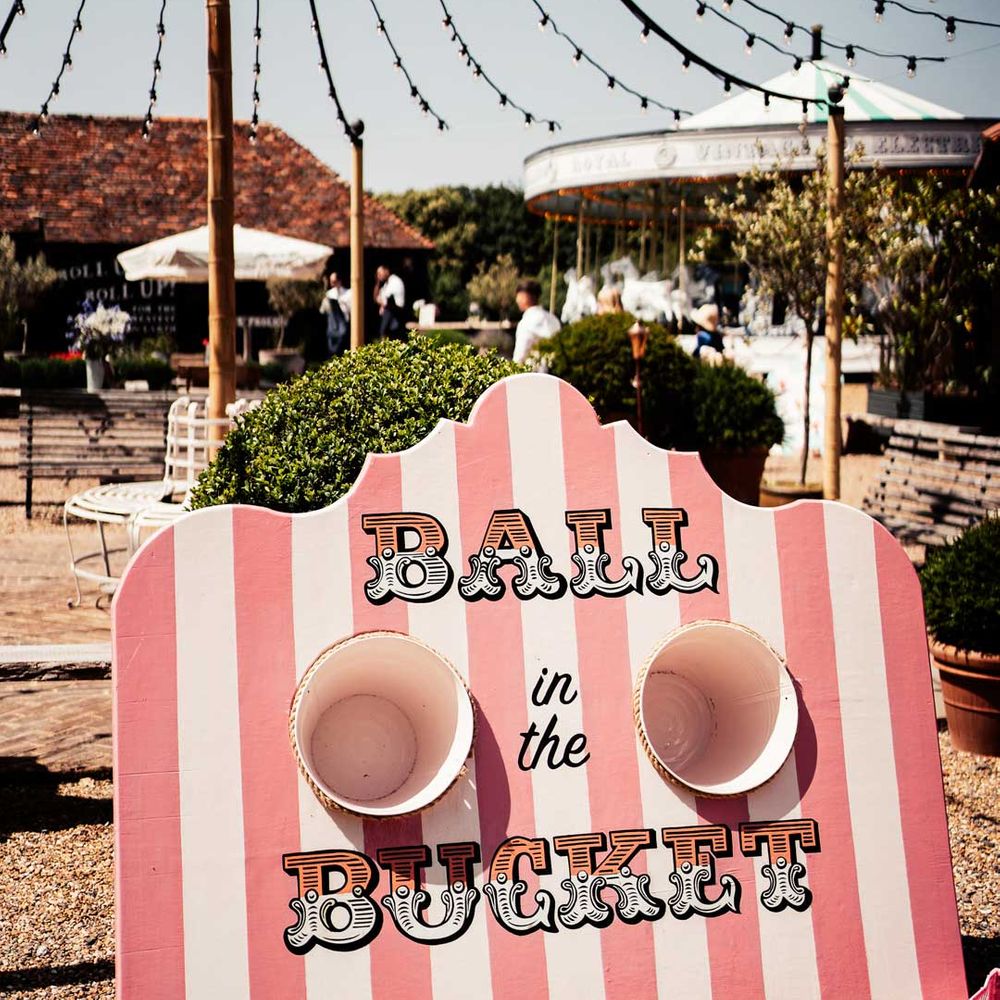 Large outdoor wedding game - pink and white ball in the bucket wedding game at Preston Court 