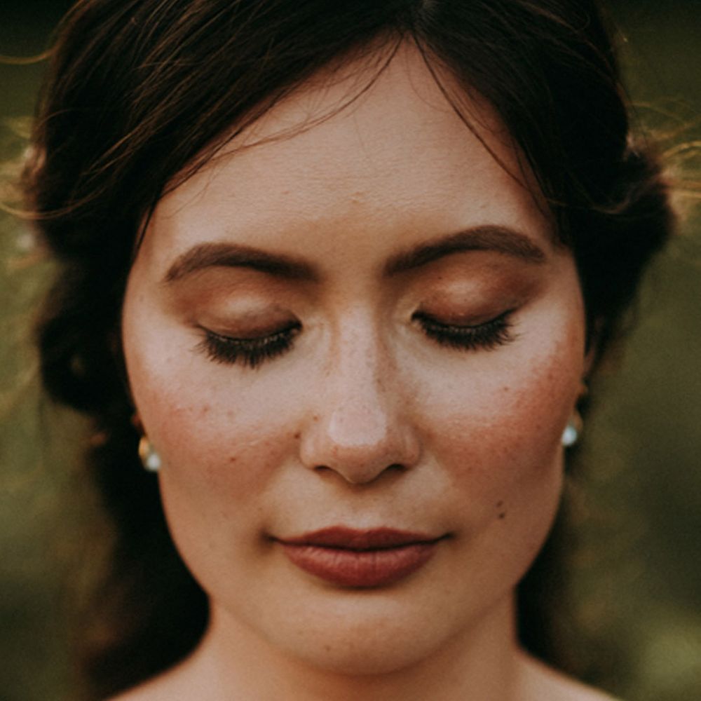 Bridal makeup - soft brown eyeshadow and dark lip - beauty section of wedding budget spreadsheet 