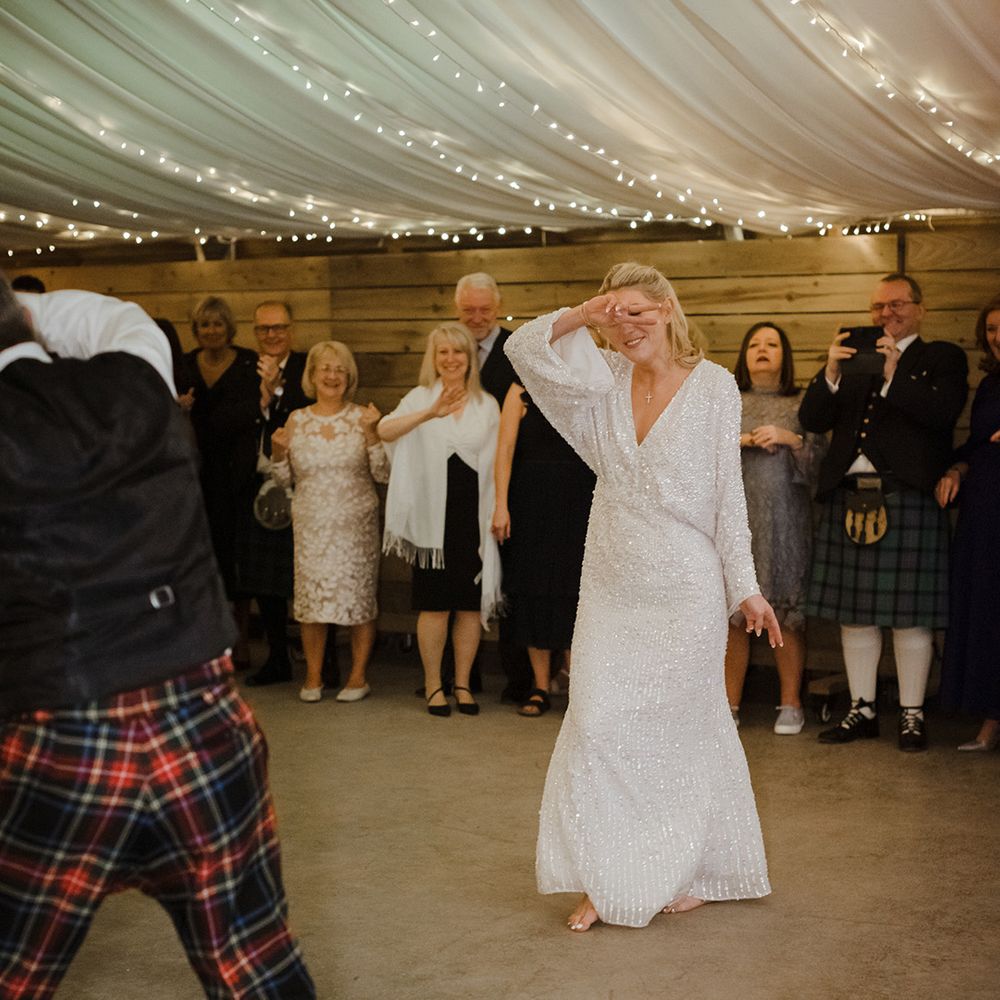 The Cowshed Crail wedding with marquee and the bride and groom having their first dance together