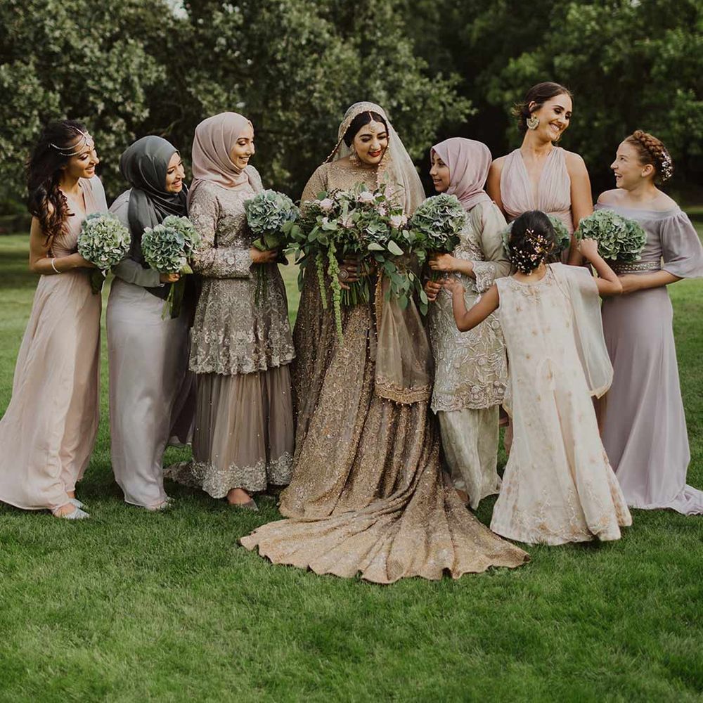 Bridal party standing around bride at Nikah wedding ceremony - hen party ideas