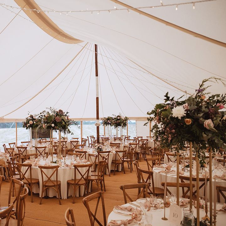 Marquee wedding reception with pink and white wedding flowers 