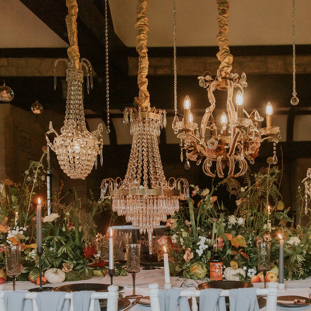 chandelier light installation over the wedding table 