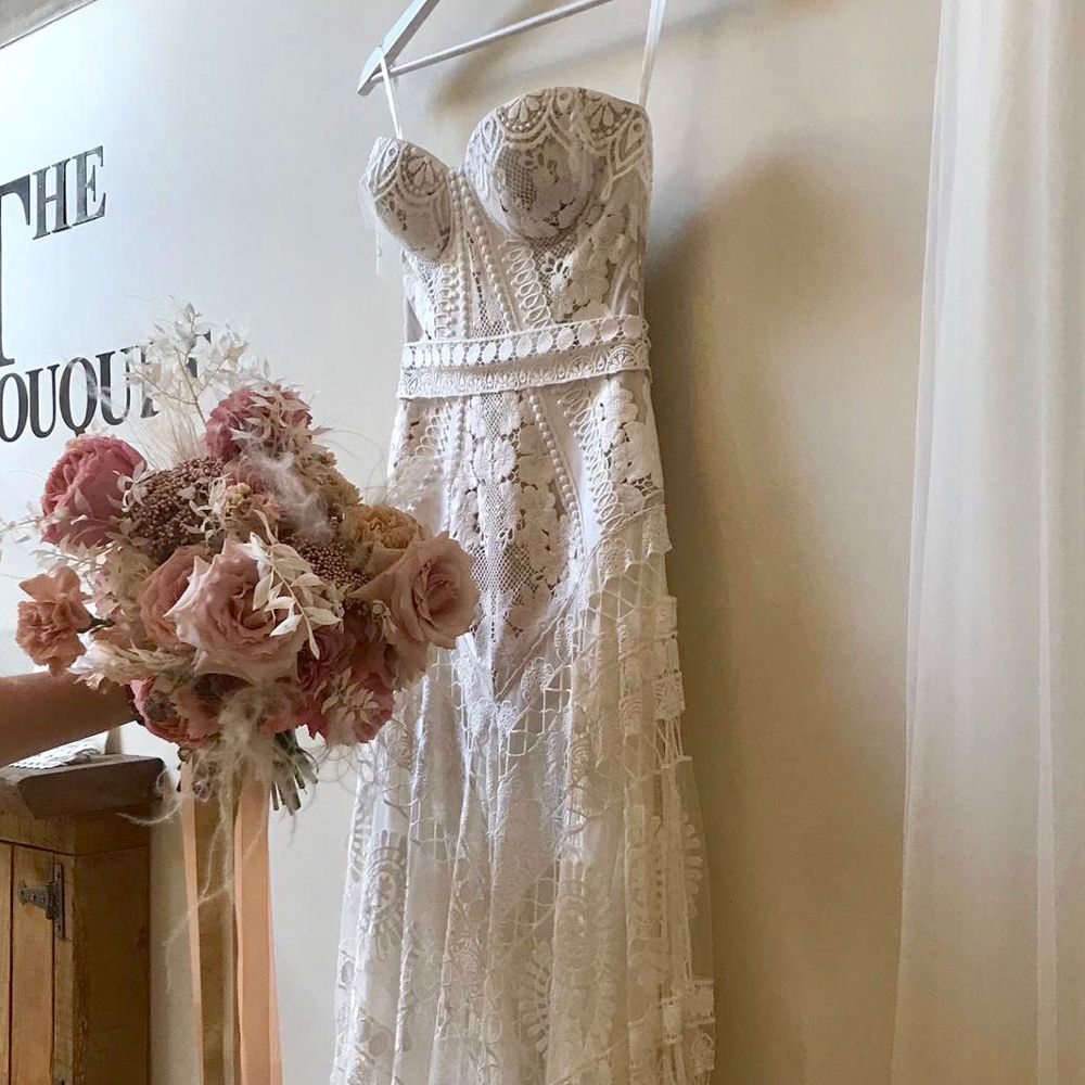 Clara Rue De Seine Wedding Gown with pink rose bridal bouquet