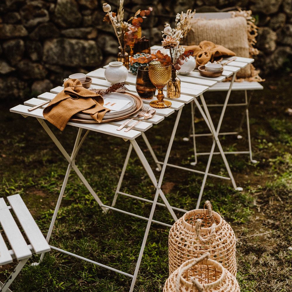 Outdoor table setting with white wooden table