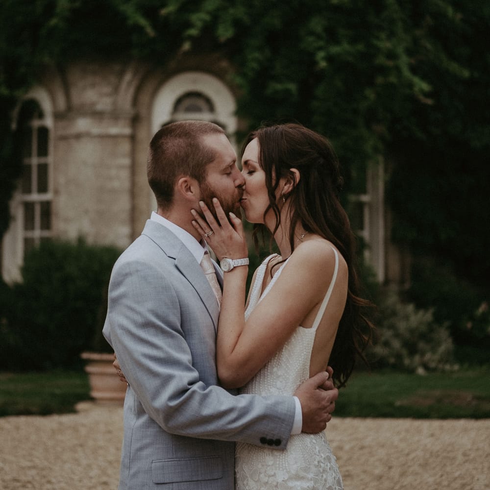 Bride and groom kiss at Hampshire wedding