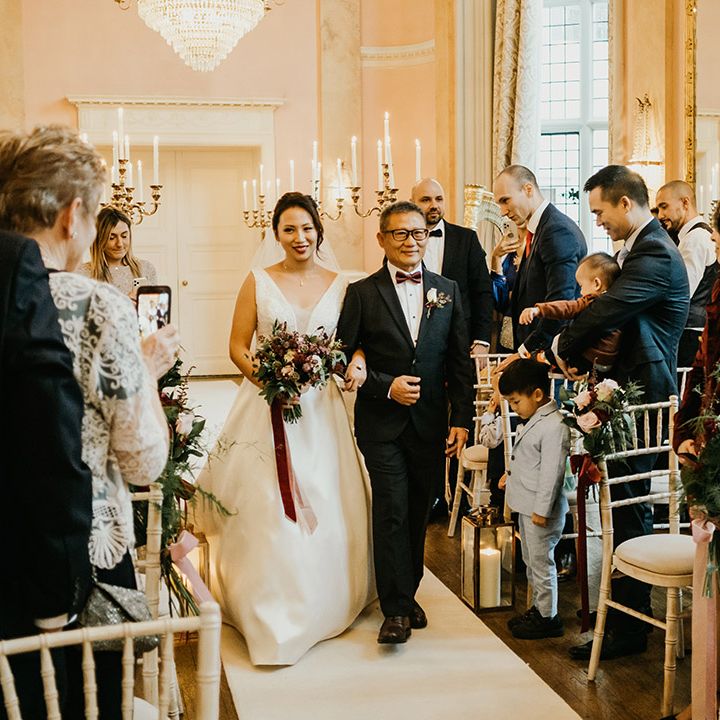 Bride walks down the aisle at Danesfield House wedding