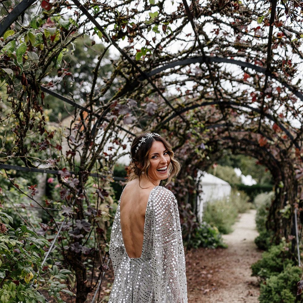 Stylish bride in a Tilly Thomas Lux crown and a silver sequin, Chosen By Kyha, wedding dress