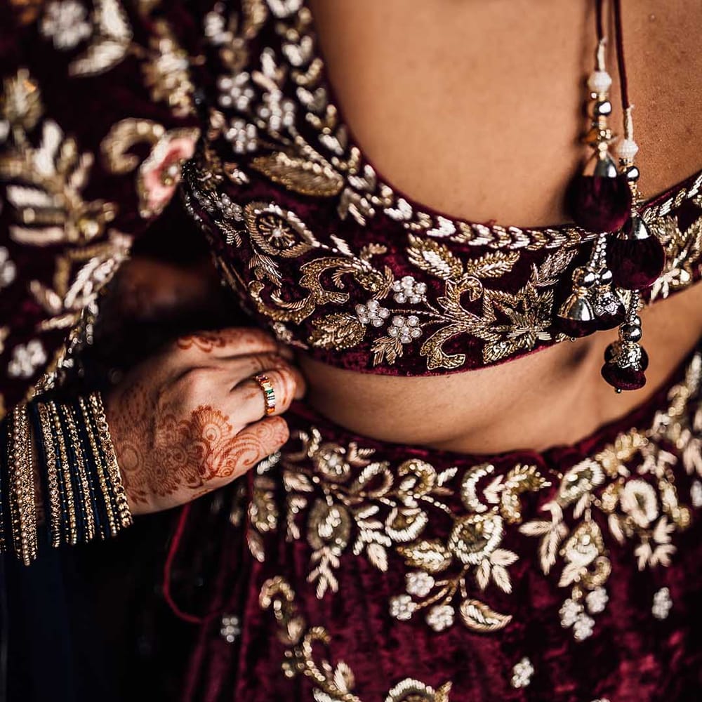 Beautiful detailed burgundy wedding dress with gold embellishment