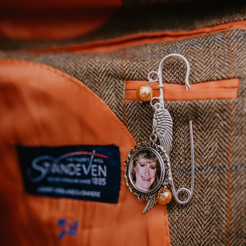 Personalised pin of the groom's mother who has passed away