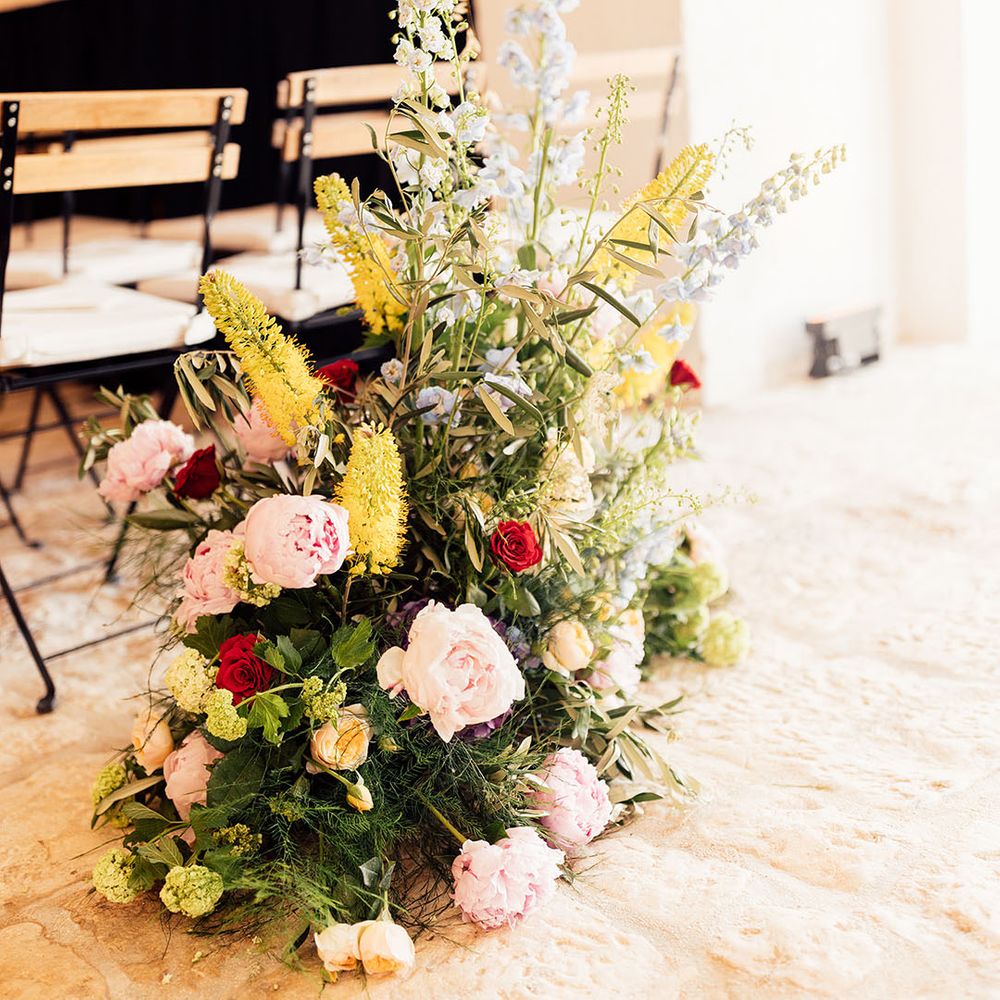 Colourful wedding flower aisle decoration 