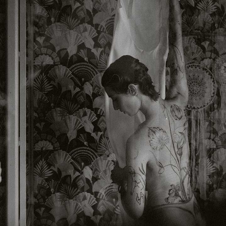 Lisa gets ready on the morning of wedding day showcasing back tattoo 