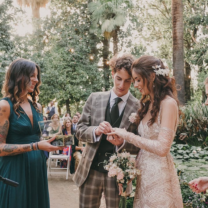 bride and groom exchanging wedding rings