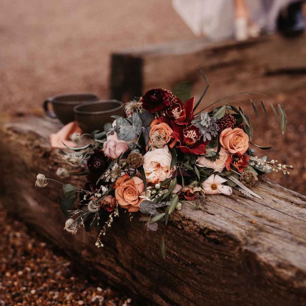 Rose, carnation, dried flower, eucalyptus and baby's breath bridal bouquet 